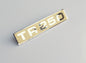 Triumph TR250 Cream & Chrome Rear Boot lid Badge, 622262